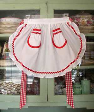 1948 white half apron with red gingham ties and trim