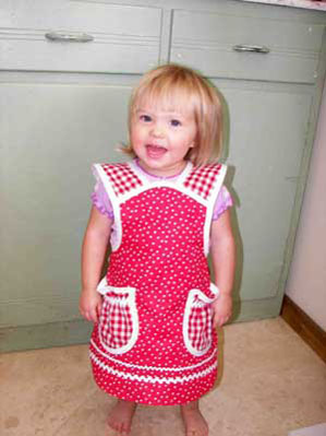 Girl red polka dot child apron in red polka dots